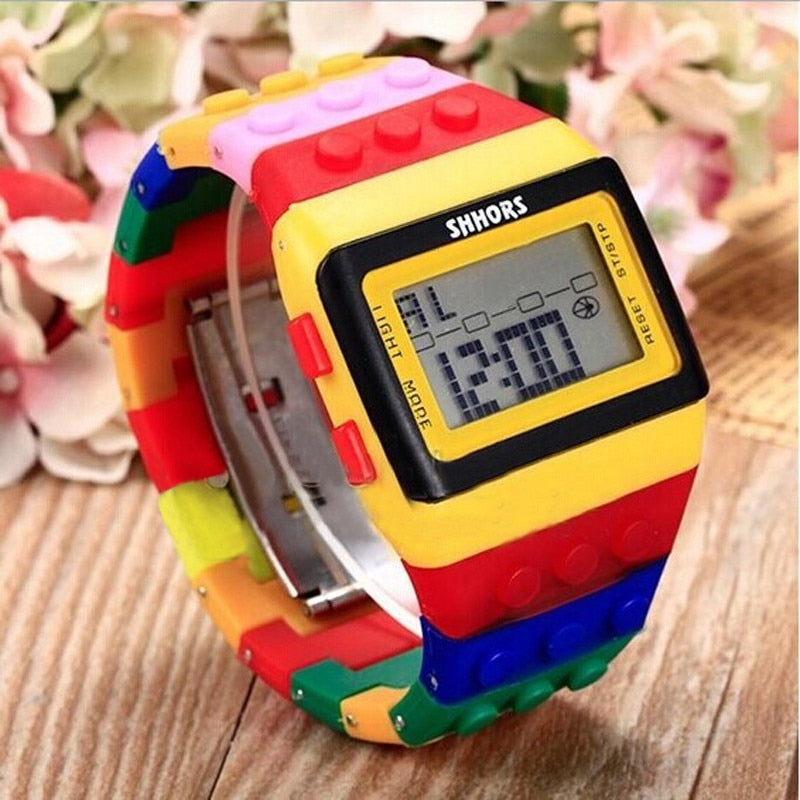 Singulier watches. Lego watch. Was Lego an important part of your childhood? Of course, mine too! THE coolest watch to wear near a bunch of programmers, scientists, or constructors. Show your friends and colleagues that you haven't grown up. Show them that you are still playful, inventive and ingenious. Show them that you're still awesome!